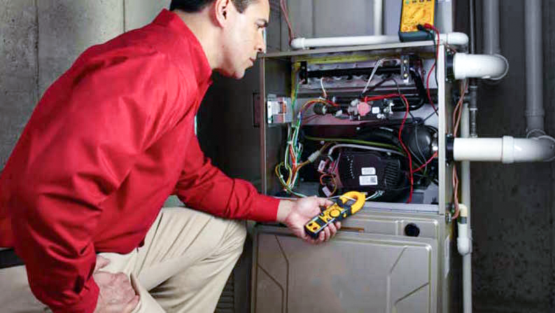 Furnace tune-up service in progress in Calgary Furnace tune-up service in progress in Calgary