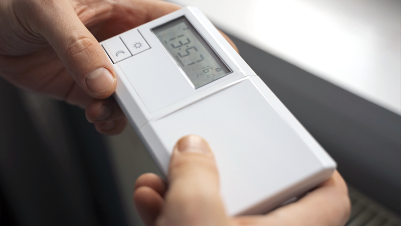 Thermostat battery replacement during Calgary furnace maintenance Thermostat battery replacement during Calgary furnace maintenance