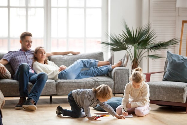 Comfortable family at home with a Calgary heat pump keeping them warm and cool