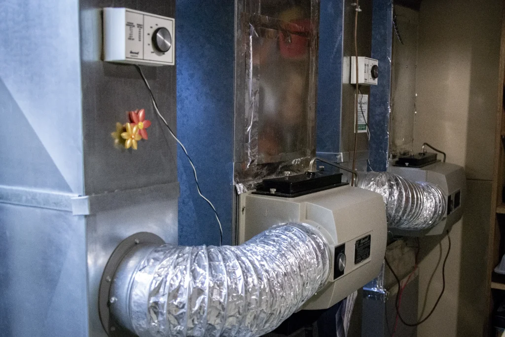 Job-site view of a Calgary double furnace installation in progress