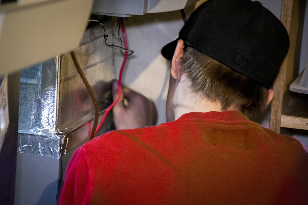 High-efficiency furnace installation in a Calgary home High-efficiency furnace installation in a Calgary home
