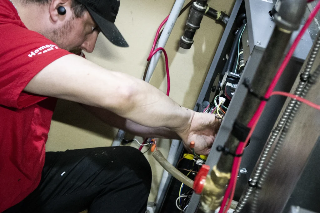 Two new high-efficiency furnaces installed side by side in a Calgary mechanical room