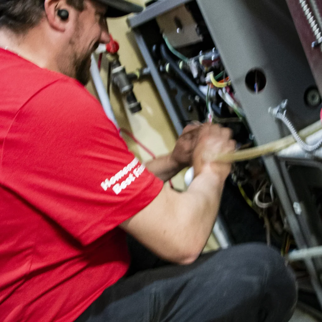 Close-up of a new furnace installation during a Calgary heating replacement