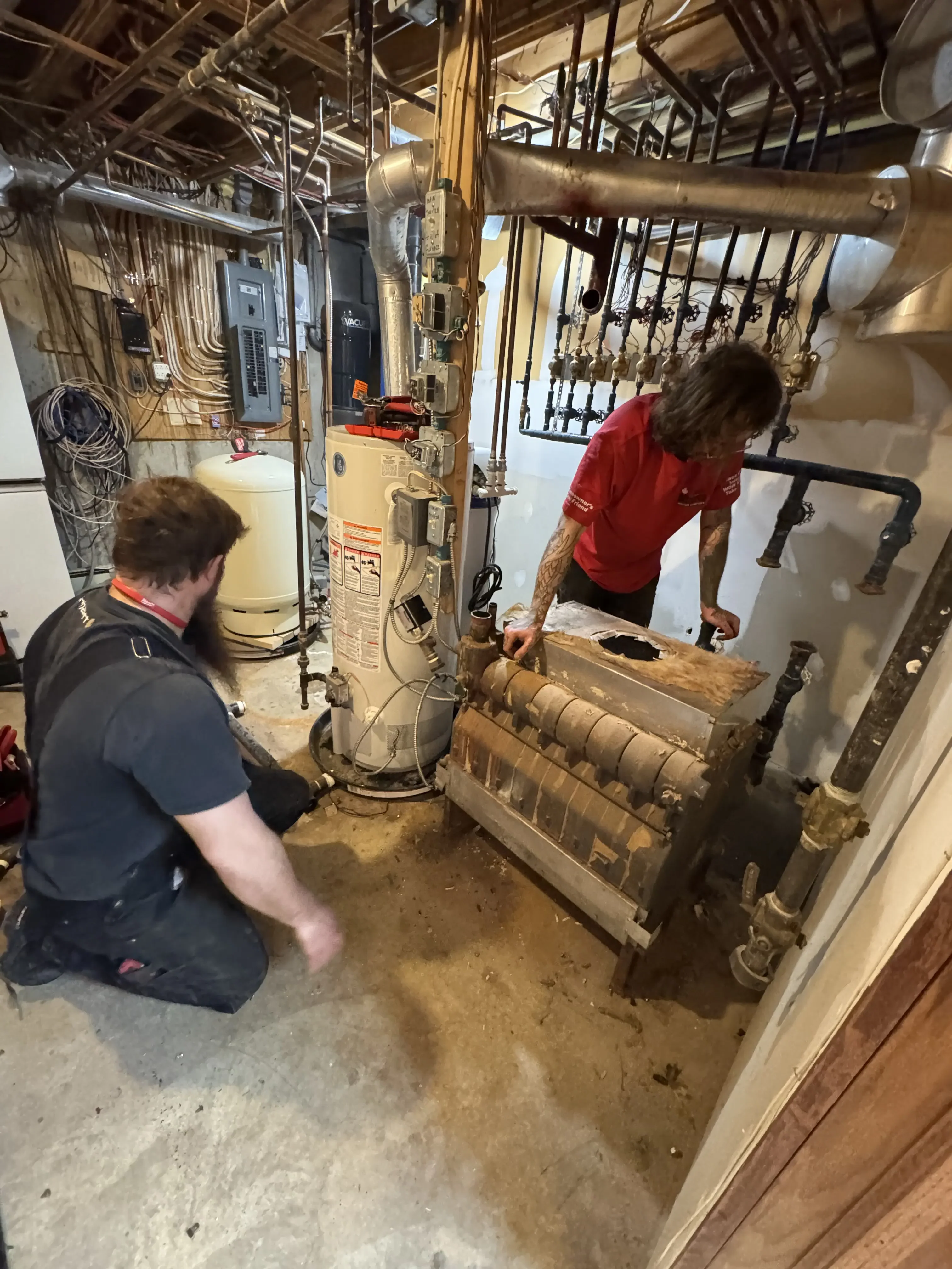Alberta Indoor Comfort technician completing a boiler replacement in Calgary Alberta Indoor Comfort technician completing a boiler replacement in Calgary