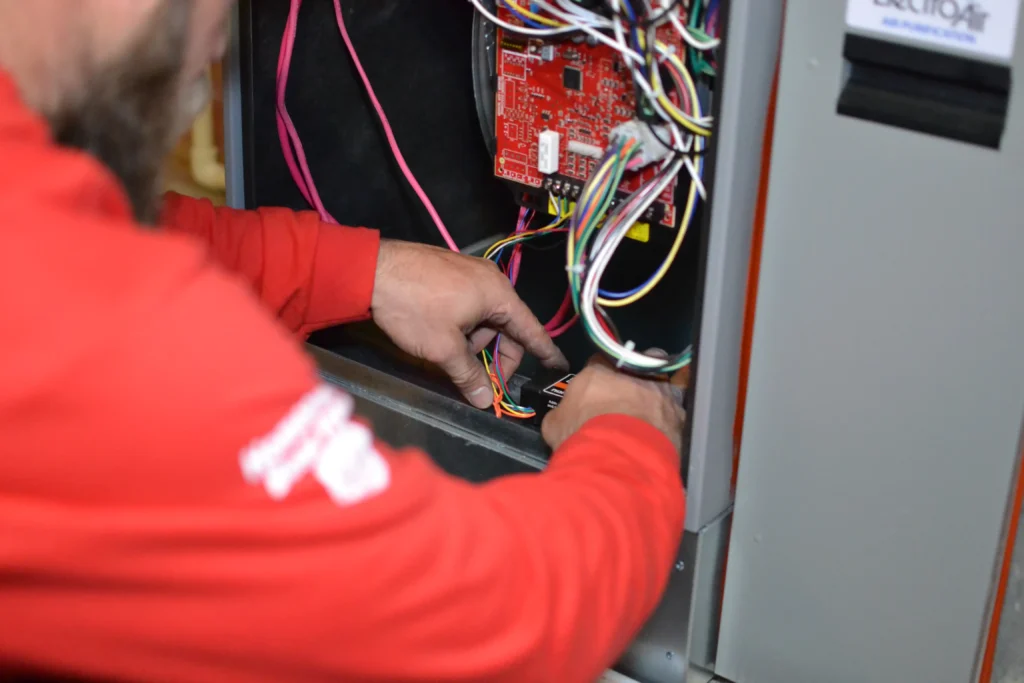 Furnace inspection and tune-up in progress at a Calgary home Furnace inspection and tune-up in progress at a Calgary home