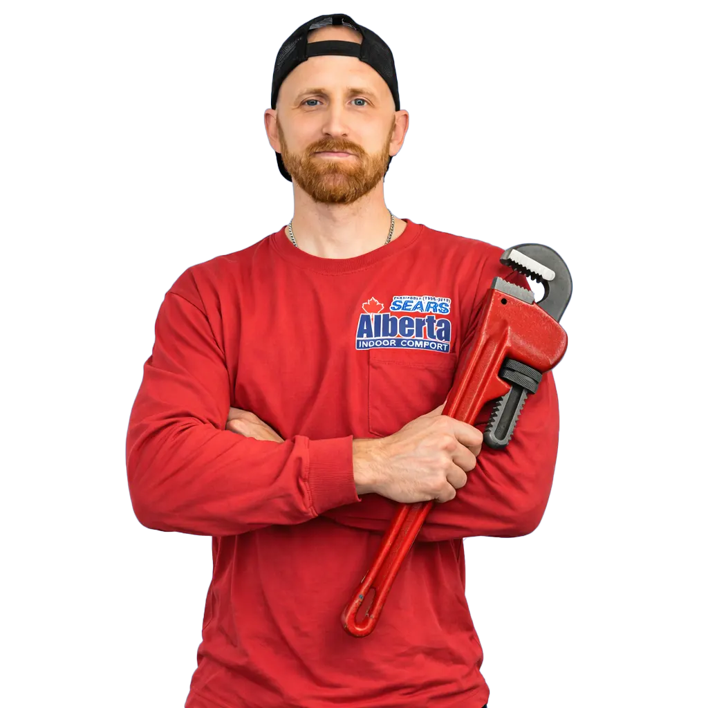 Alberta Indoor Comfort technician Ben fixing a drain in a Calgary home, drain repair service