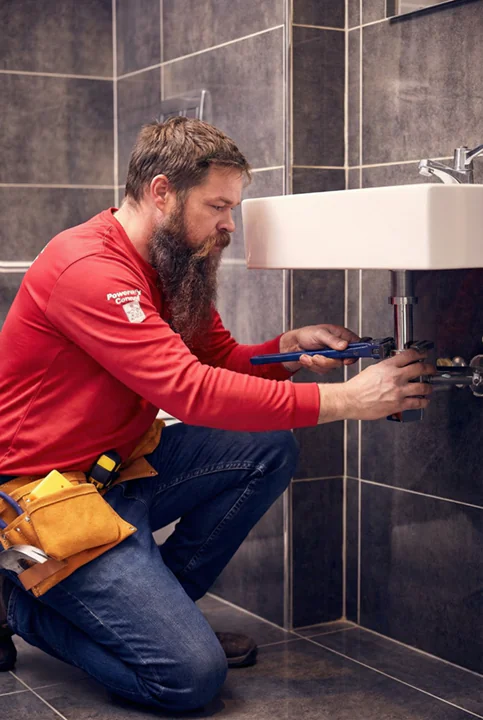 Alberta Indoor Comfort plumbing technician completing a Calgary bathroom renovation