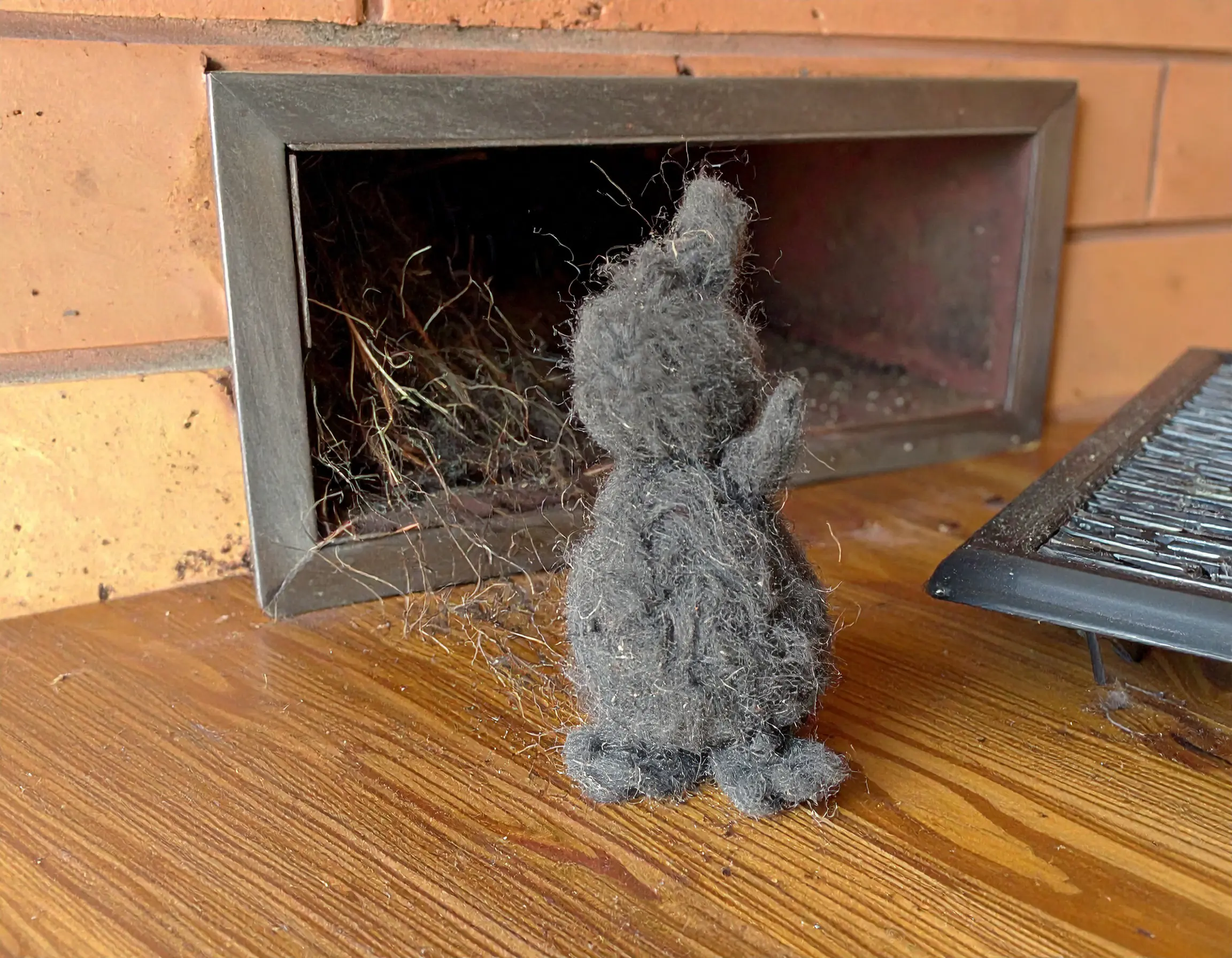 PureCool™: Calgary’s Premium Air Wellness Cooling Bundleair conditioner installation Calgary_dust-hair ball in the shape of a bunny waving hi close to the vent-duct work on the w AC INSTALLATION CALGARY